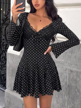 Black polka dot lace trimmed V-neck mini dress from D'Journé Fashion, front view