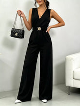 Sleeveless Wide Leg Jumpsuit by D'Journé Fashion, model wearing black belted jumpsuit front view