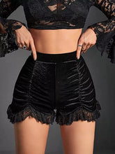 D'Journé Fashion velvet ruched lace trim shorts in black, front view on model