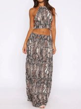 Halter Crop Backless Top and Maxi Skirt Set by D'Journé Fashion, model wearing black two-piece front view
