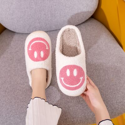 White and pink smiley face plush slippers from D'Journé Fashion, top view
