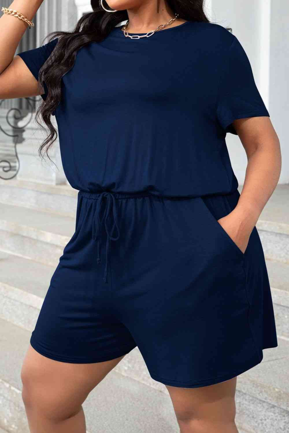 D'Journé Fashion plus size drawstring waist romper with pockets, model wearing black, front view