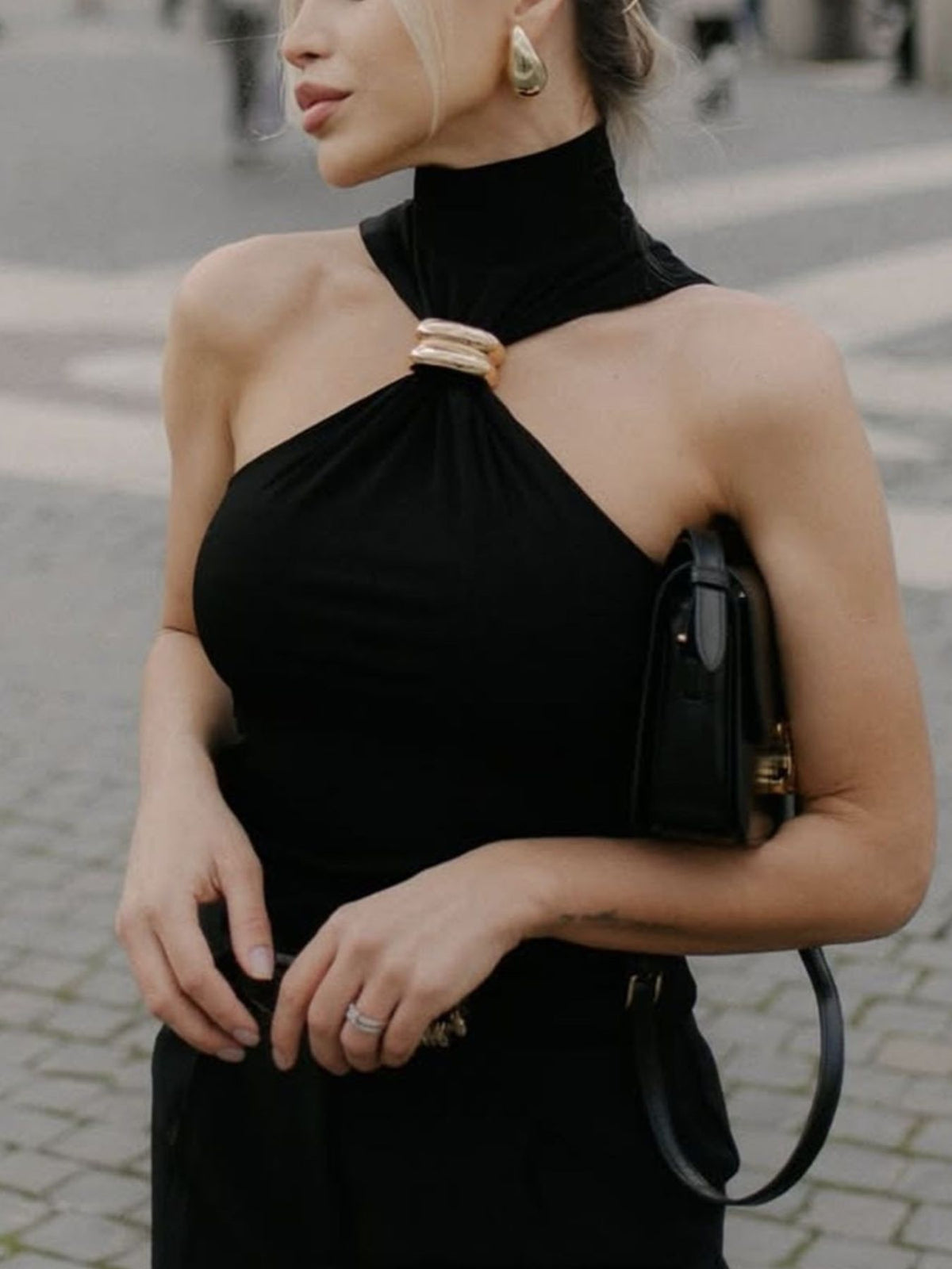 Black turtleneck tank gold-tone ring cutout detail