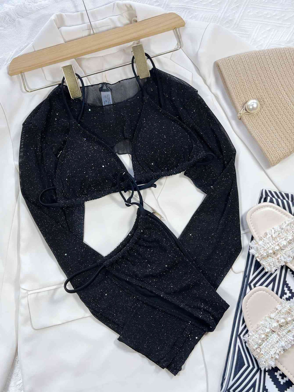 Model wearing black glitter three-piece bikini swim set front view