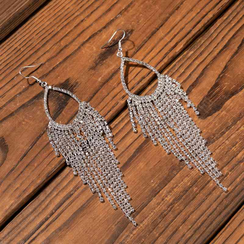 Alloy dangle earrings, model wearing, side view
