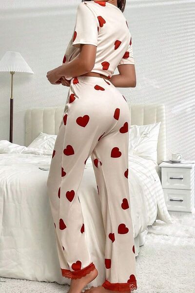 White heart print round neck top and drawstring pants lounge set on model, front view
