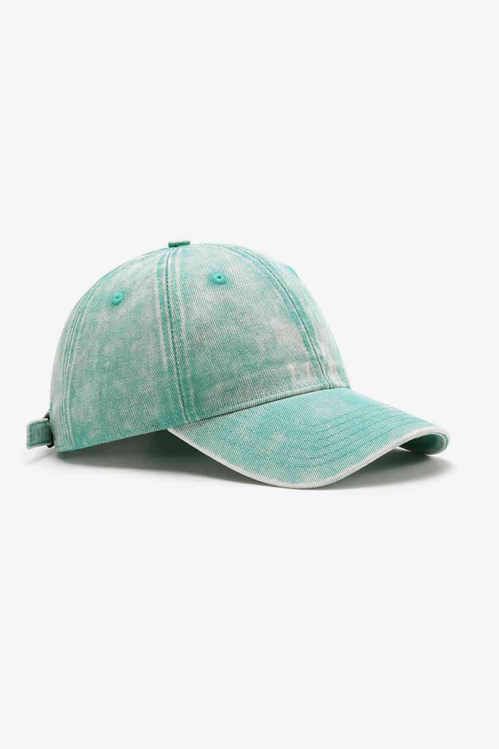 Model wearing plain adjustable baseball cap