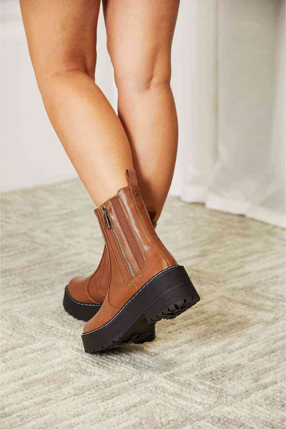Side zip platform boots pair, back view