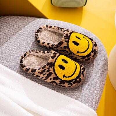 Cozy leopard print smiley face slippers worn at home