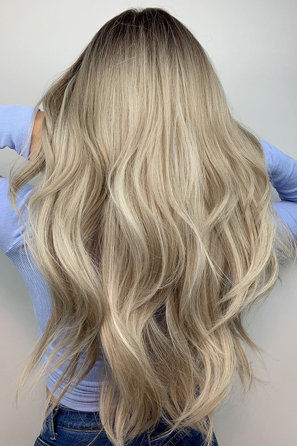 Ash blonde balayage wavy wig on mannequin, side view
