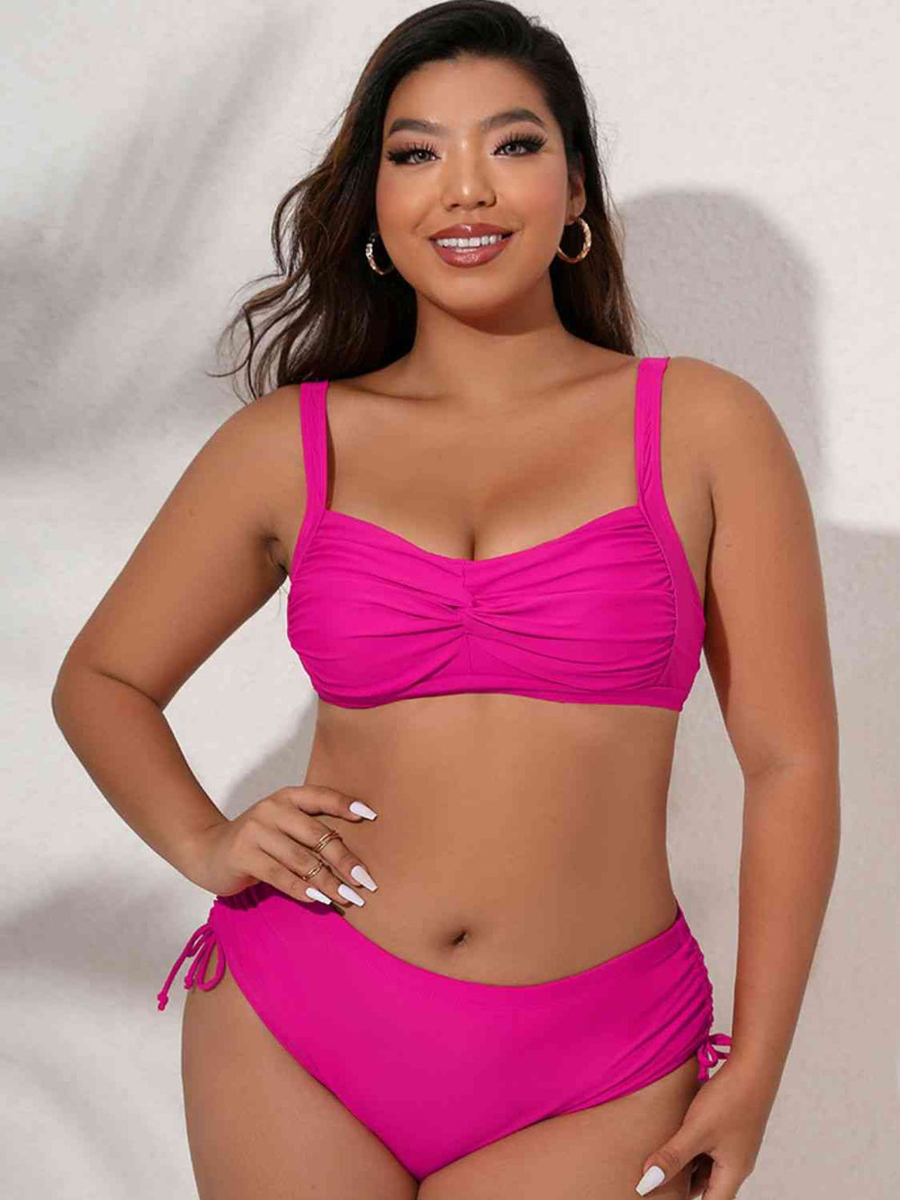 Fuchsia plus size twist front bikini set, front view on model