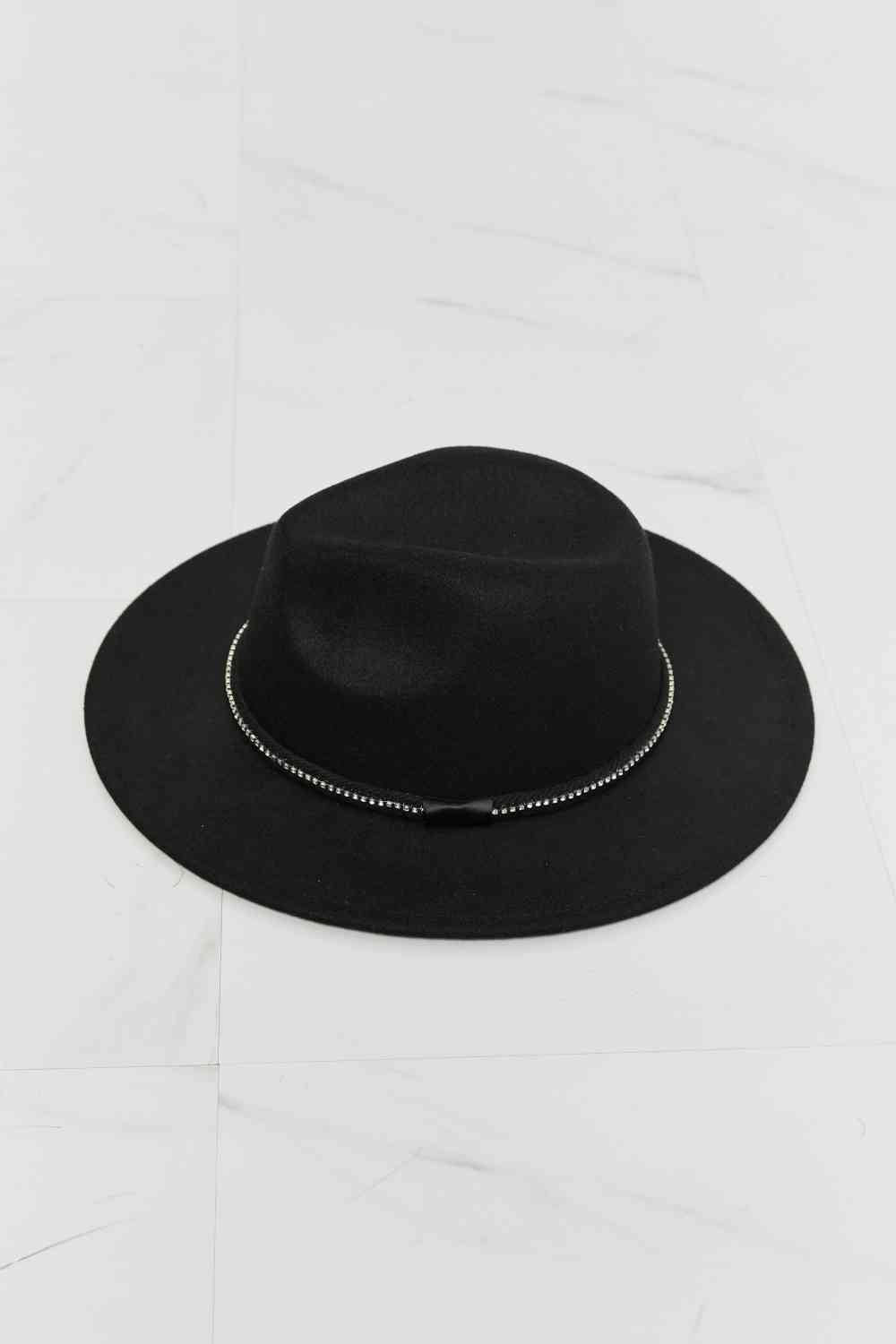 Black fedora hat, top view of crown and brim
