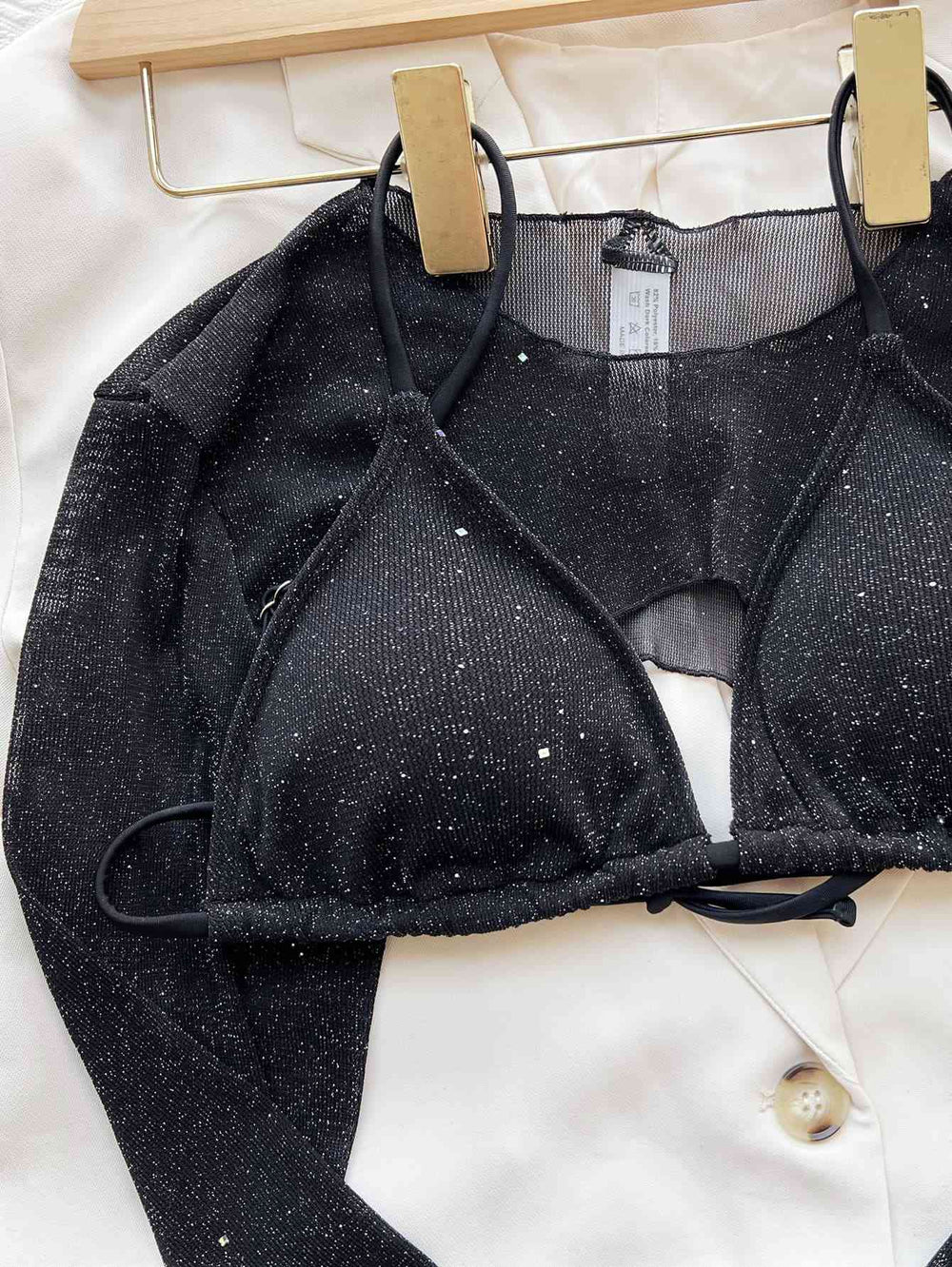 Black glitter swim set detail showing shimmer fabric and removable padding