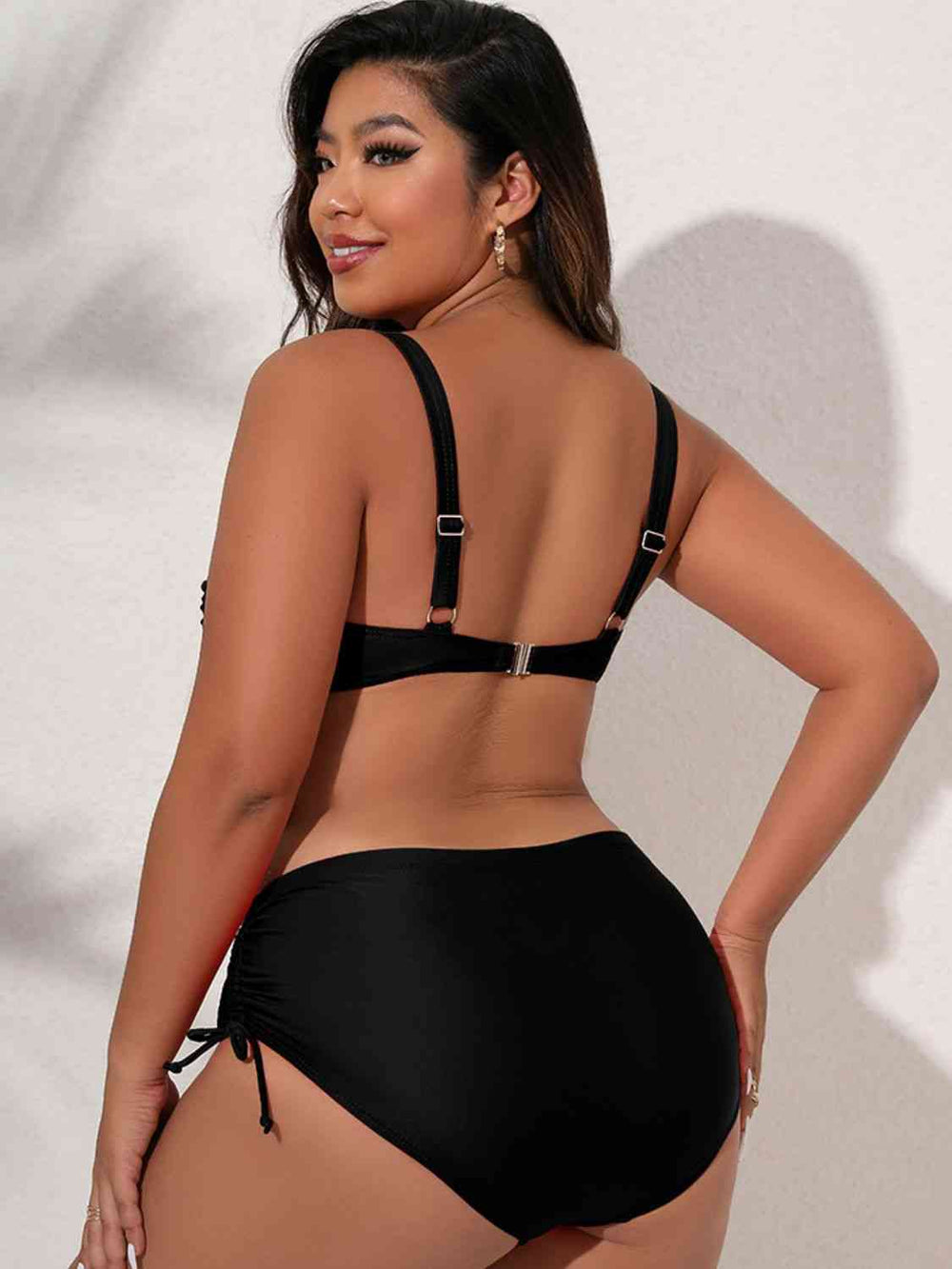 Black plus size twist front bikini set, front view on model
