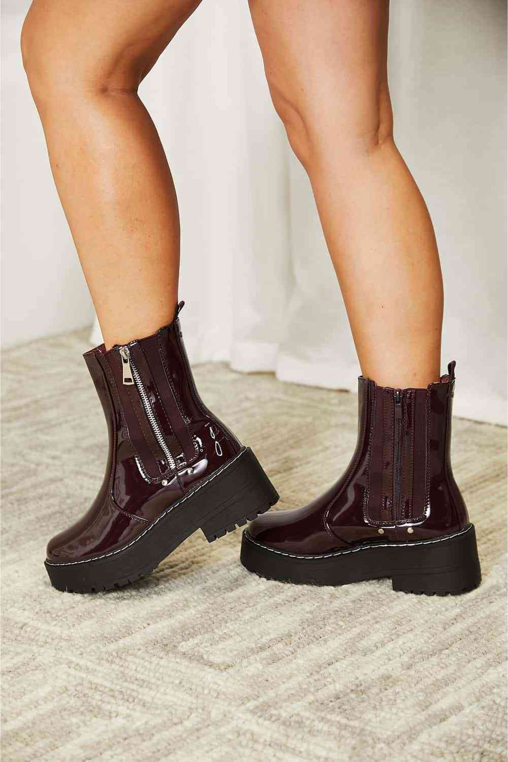 Side zip platform boot, glossy patent finish close-up