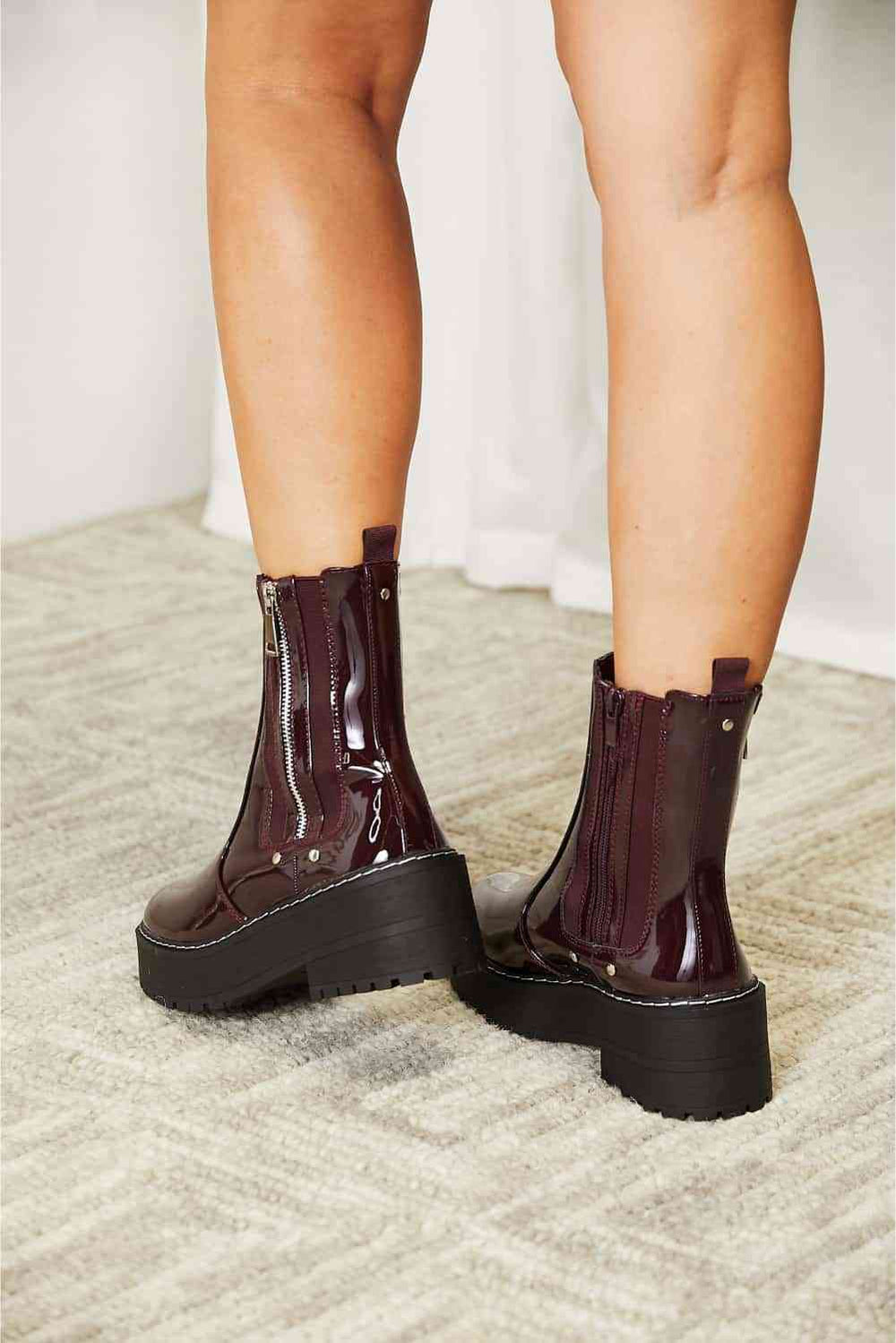 Side zip platform boots in wine, back heel view