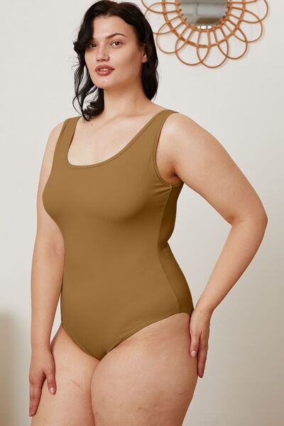 Model wearing camel square neck sleeveless bodysuit, full length view